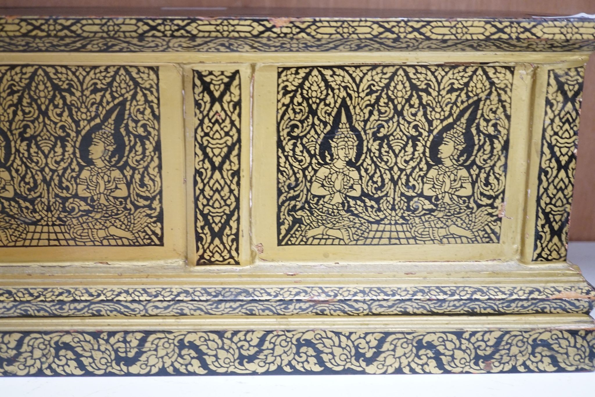 A Thai Buddhist sutra holder, 67 cms wide x 21 cms high.